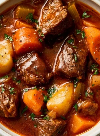 Delicious cozy crockpot beef stew simmering in a bowl