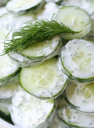 Creamy cucumber salad with onions and a sweet tangy dressing