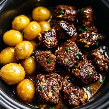 Delicious Garlic Butter Beef Bites served with golden potatoes