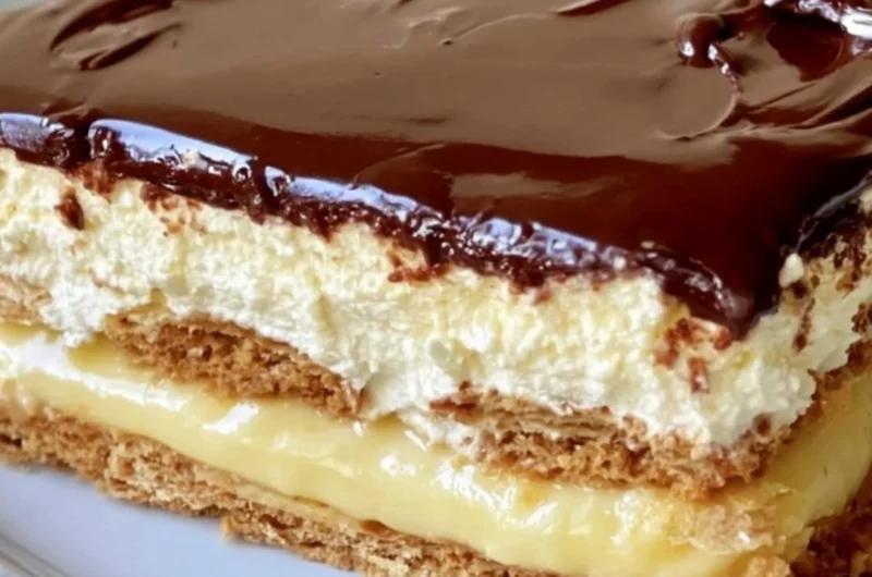 No-bake eclair cake with layers of cream and chocolate frosting.