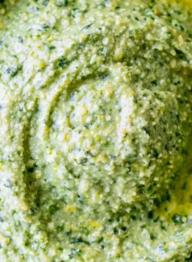 Nut-free pesto sauce made with fresh basil and olive oil for a healthy twist.