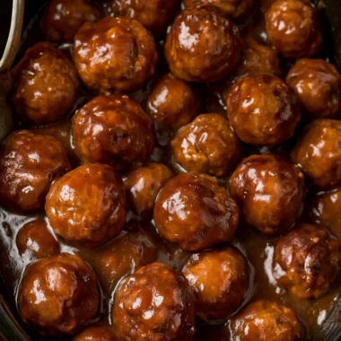 Slow cooker Salisbury steak meatballs served with gravy over mashed potatoes