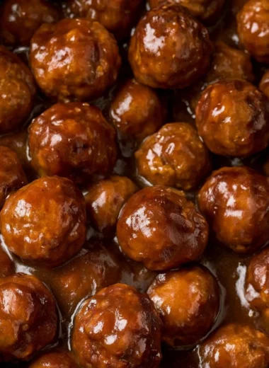 Slow cooker Salisbury steak meatballs served with gravy over mashed potatoes