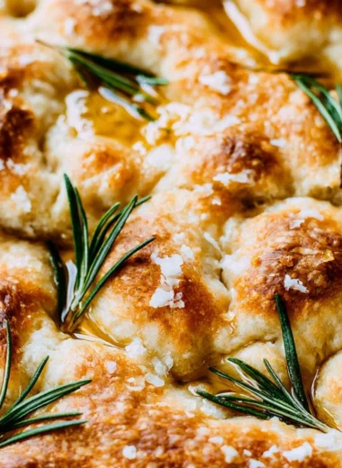 Freshly baked same day sourdough focaccia bread with herbs and olive oil
