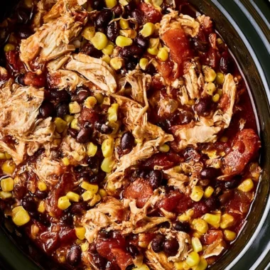 Delicious slow cooker chicken burrito bowls served with toppings.