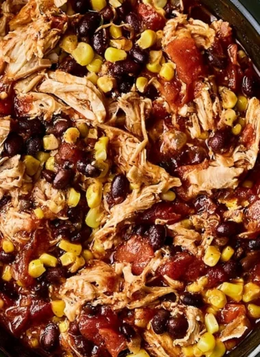Delicious slow cooker chicken burrito bowls served with toppings.