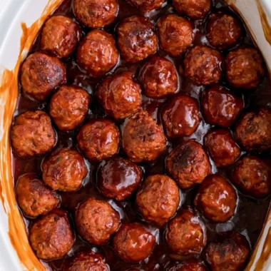 Cozy three-ingredient grape jelly meatballs served on a platter