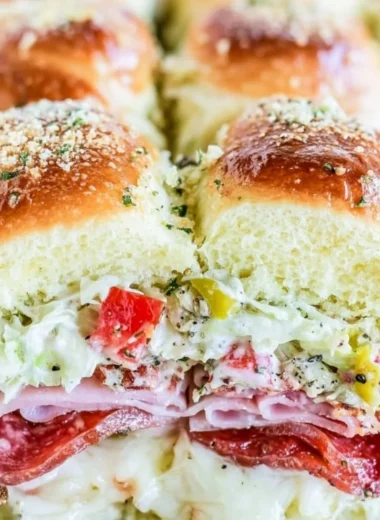 Italian grinder sliders with savory ingredients on a platter